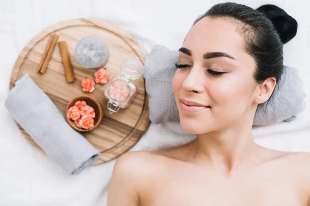 Woman receiving a relaxing facial treatment with a soothing face mask